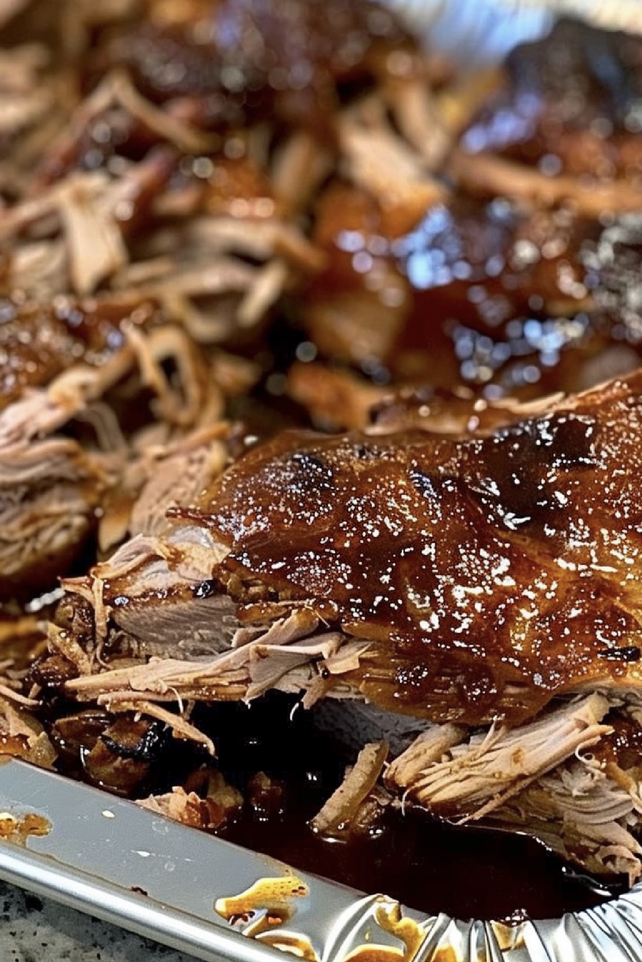 Discover the authentic taste of Hawaii with this easy Kalua Pig recipe, made in your slow cooker with just three ingredients!