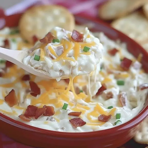 Score big on game day with this irresistible cheese and bacon dip that's easy to make and even easier to love!