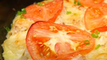 Image of a juicy chicken and potato skillet fresh out of the oven.