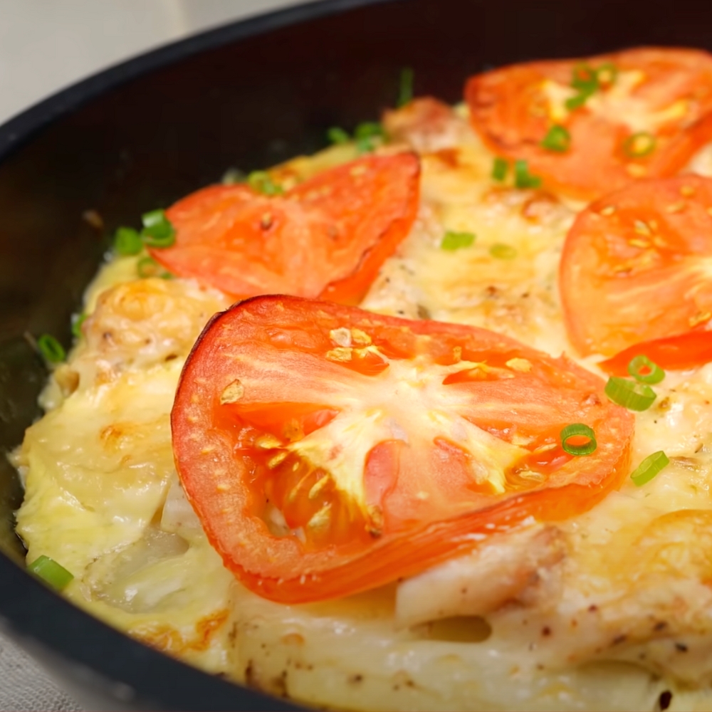 Image of a juicy chicken and potato skillet fresh out of the oven.