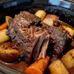 Delicious slow cooker pot roast with tender beef and savory vegetables, perfect for easy family dinners.